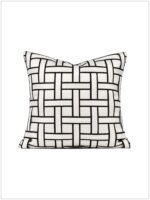 Black and white woven throw pillow design, suitable for modern interior design.