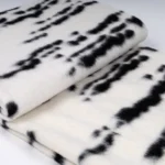 Showroom Hotel Villa: Italian-style modern luxury sofa with throw and bedspread; black-and-white tweed striped footboard throw - Image 4