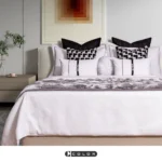 Soft Furnishings for Model Homes: Luxury 4-Piece Bedding Set in Nordic Black, White, and Brown with Gold Accents and Tasseled Pillows