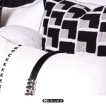 Soft Furnishings for Model Homes: Luxury 4-Piece Bedding Set in Nordic Black, White, and Brown with Gold Accents and Tasseled Pillows - Image 3